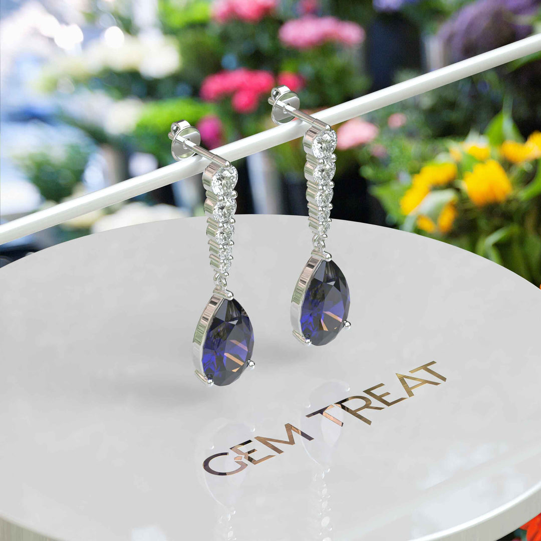 Sapphire Serenade: Pear Cut Blue Sapphire Earrings in a Graceful Drop Design.