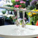 Load image into Gallery viewer, Sparkling Sips: Pear Shaped Champagne Moissanite Drop Earrings.
