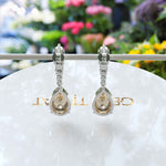 Load image into Gallery viewer, Sparkling Sips: Pear Shaped Champagne Moissanite Drop Earrings.
