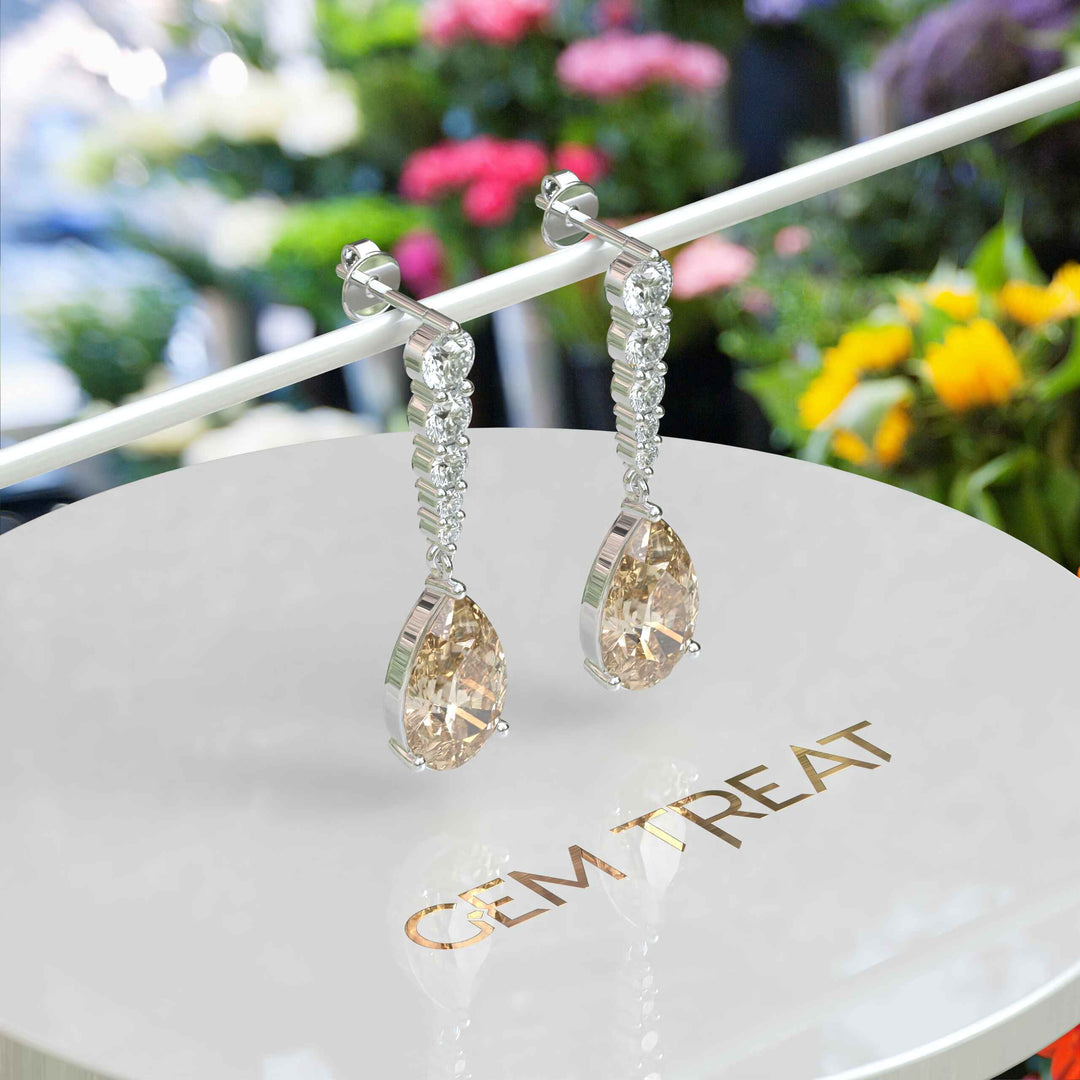 Sparkling Sips: Pear Shaped Champagne Moissanite Drop Earrings.