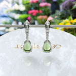 Load image into Gallery viewer, Ethereal Glow: Peridot Pear Drop Earrings with Moissanite Embellishments
