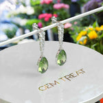 Load image into Gallery viewer, Ethereal Glow: Peridot Pear Drop Earrings with Moissanite Embellishments
