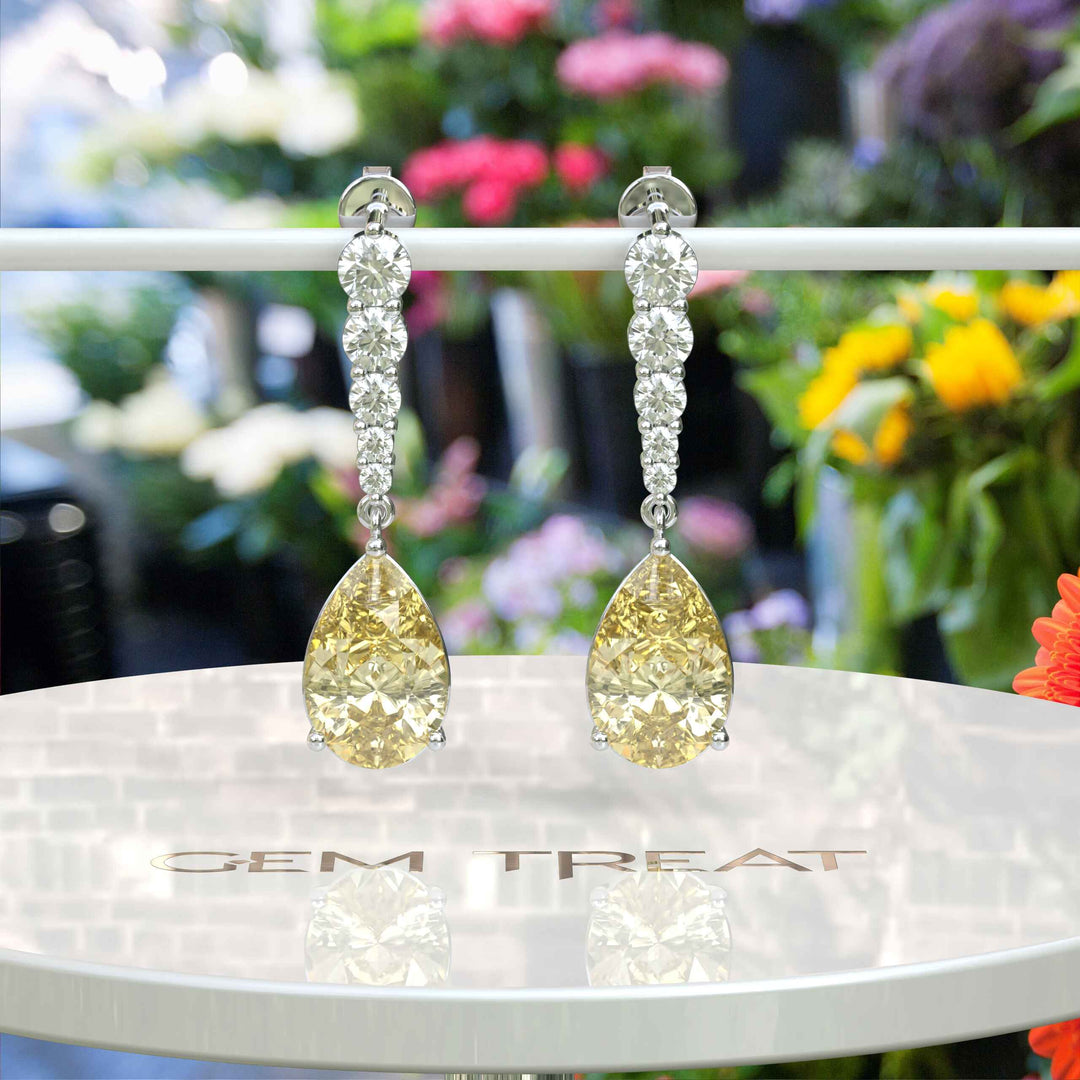 Mellow Radiance: Glistening Pear Cut Yellow Moissanite Drop Earrings.