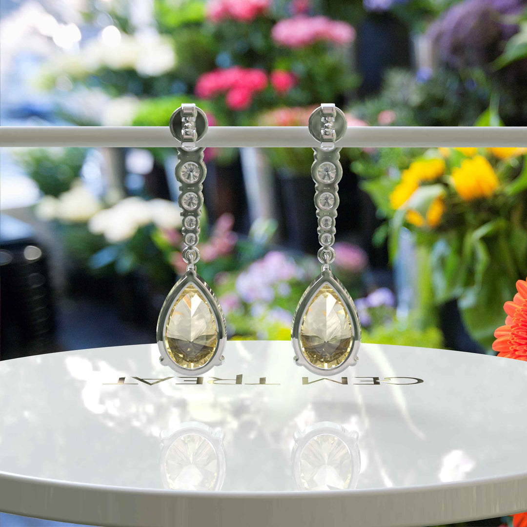 Mellow Radiance: Glistening Pear Cut Yellow Moissanite Drop Earrings.