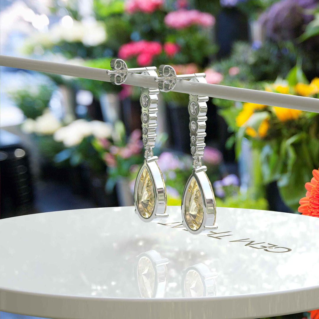 Mellow Radiance: Glistening Pear Cut Yellow Moissanite Drop Earrings.