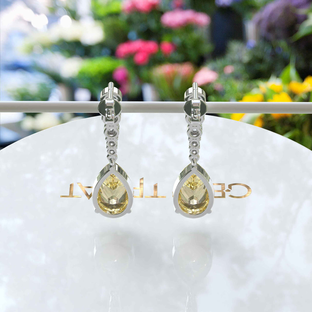 Mellow Radiance: Glistening Pear Cut Yellow Moissanite Drop Earrings.