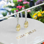 Load image into Gallery viewer, Mellow Radiance: Glistening Pear Cut Yellow Moissanite Drop Earrings.
