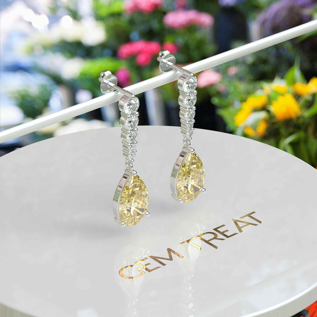 Mellow Radiance: Glistening Pear Cut Yellow Moissanite Drop Earrings.