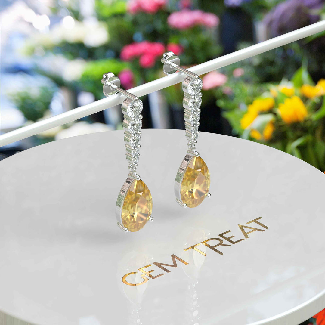 Golden Drops: Pear Cut Yellow Sapphire Drop Earrings with Moissanite Sparkle.