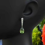 Load image into Gallery viewer, Ethereal Glow: Peridot Pear Drop Earrings with Moissanite Embellishments
