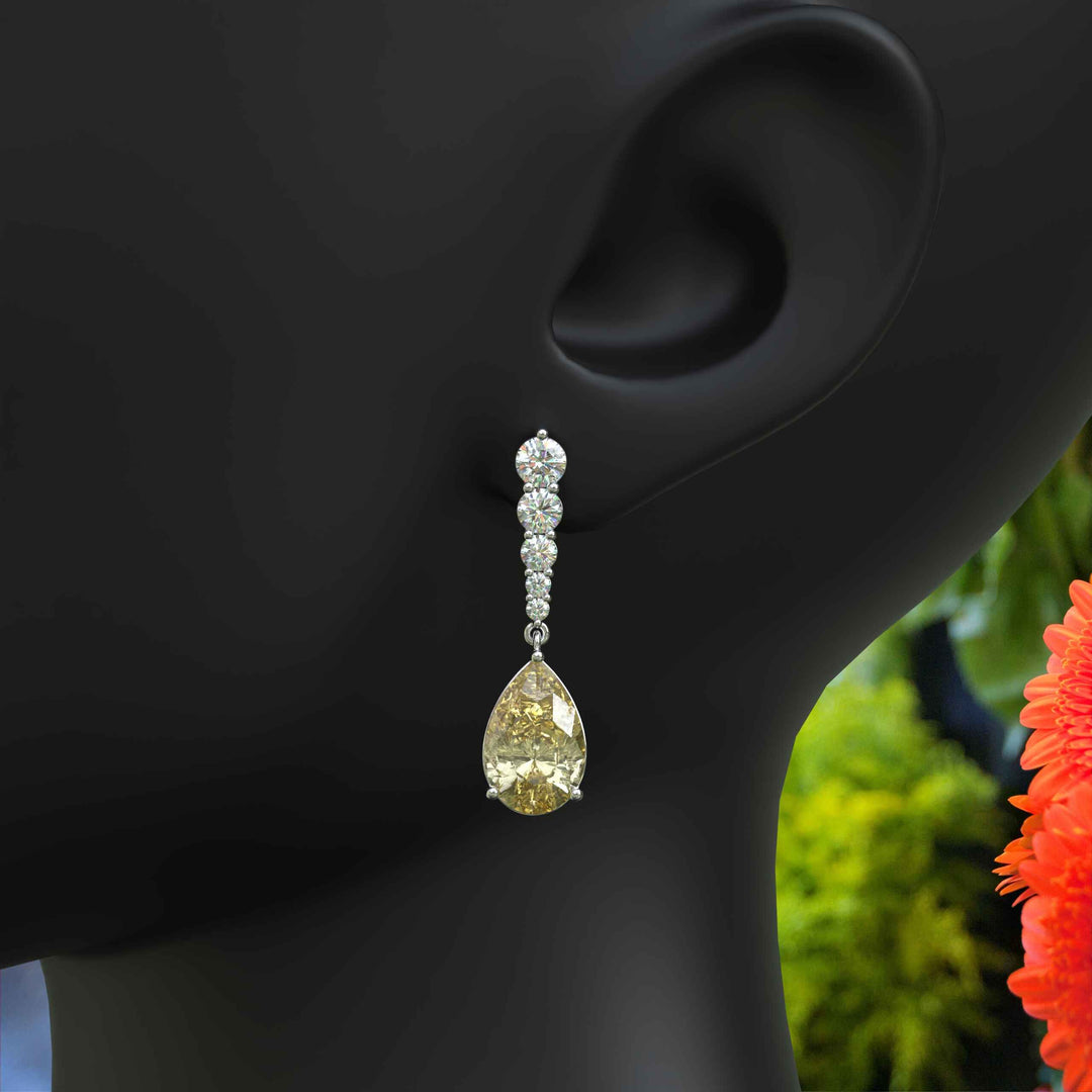 Mellow Radiance: Glistening Pear Cut Yellow Moissanite Drop Earrings.