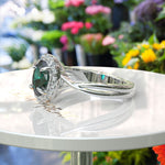 Load image into Gallery viewer, Mystic Green Gleam: Silver Halo Ring Centering Oval Emerald, Enhanced by Twisted Shank Artistry
