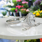 Load image into Gallery viewer, Spiraled Elegance: Halo Ring Featuring 1ct Oval White Moissanite on a Twisted Silver Band
