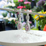 Load image into Gallery viewer, Blush Bloom: Pear Pink Sapphire Drop Earrings with Moissanite Halo
