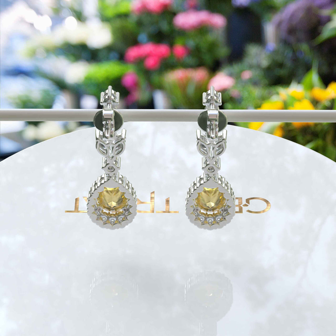 Golden Luster: Pear Cut Yellow Sapphire Halo Drop Earrings.