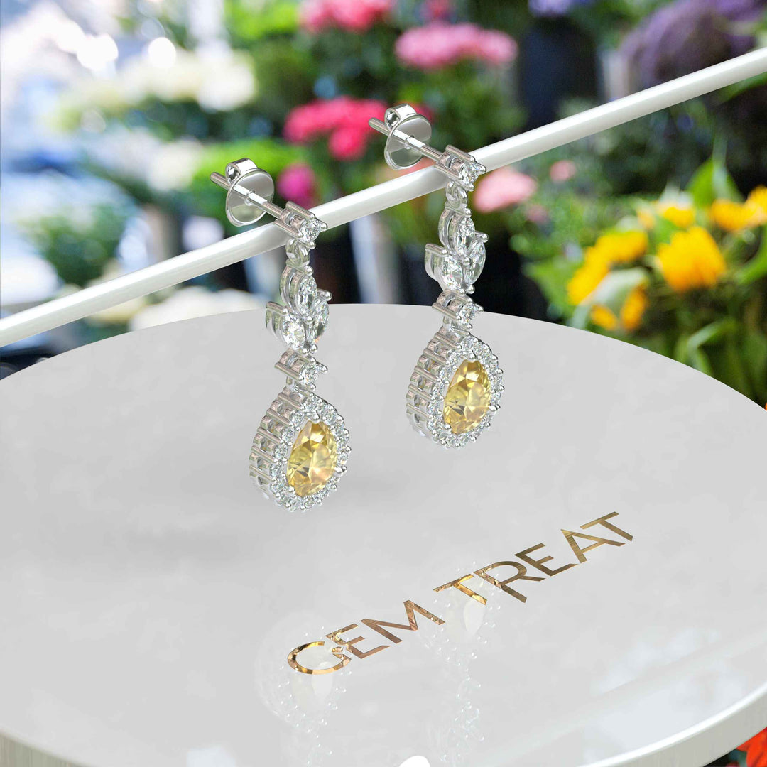 Golden Luster: Pear Cut Yellow Sapphire Halo Drop Earrings.