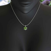 Jeweled Symphony: A Round Peridot Solitaire Pendant Necklace Awaits
