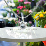 Load image into Gallery viewer, Radiant Sea Blue Round Aquamarine Solitaire Pendant Necklace in Sterling Silver
