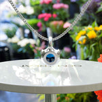 Load image into Gallery viewer, Blue Haven: A Tranquil Solitaire Round London Blue Topaz Pendant Necklace, Ocean&#39;s Embrace
