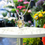 Load image into Gallery viewer, Golden Embrace: Sparkling Round Yellow Sapphire Solitaire Pendant Necklace Masterpiece
