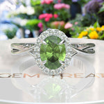 Load image into Gallery viewer, Green Oasis &amp; Spiraled Elegance: Halo Ring Spotlighting Oval Peridot with Twisted Shank
