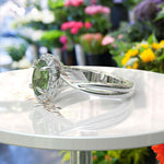 Load image into Gallery viewer, Green Oasis &amp; Spiraled Elegance: Halo Ring Spotlighting Oval Peridot with Twisted Shank
