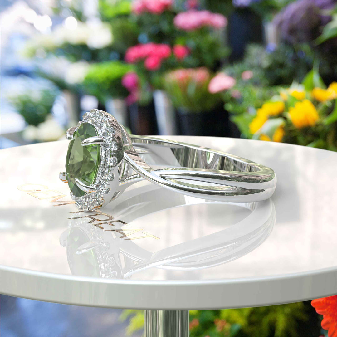 Green Oasis & Spiraled Elegance: Halo Ring Spotlighting Oval Peridot with Twisted Shank