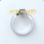 Load image into Gallery viewer, Green Oasis &amp; Spiraled Elegance: Halo Ring Spotlighting Oval Peridot with Twisted Shank
