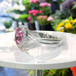 Load image into Gallery viewer, Celebrate Love with Sparkling Halo: Oval Pink Sapphire Ring with Twisted Shank
