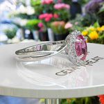 Load image into Gallery viewer, Celebrate Love with Sparkling Halo: Oval Pink Sapphire Ring with Twisted Shank
