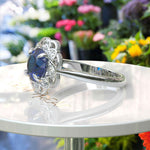 Load image into Gallery viewer, Deep Azure Dream: Round London Blue Topaz Ring with Moissanite Halo Brilliance
