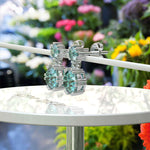 Load image into Gallery viewer, Ocean Depths: Cyan Blue Moissanite Round Drop Earrings.
