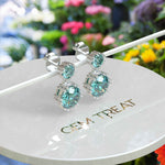 Load image into Gallery viewer, Ocean Depths: Cyan Blue Moissanite Round Drop Earrings.
