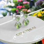 Load image into Gallery viewer, Spring Essence: Luminous Round Peridot Earrings in Elegant Drop Style.
