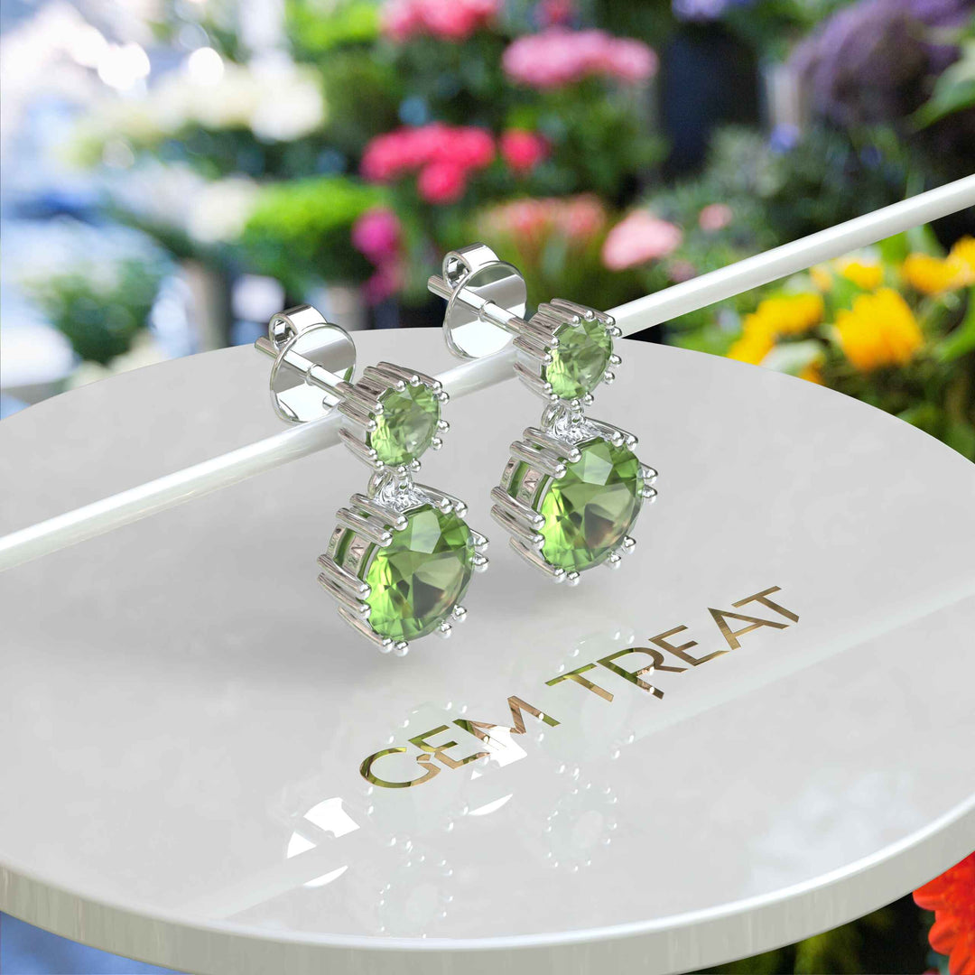 Spring Essence: Luminous Round Peridot Earrings in Elegant Drop Style.