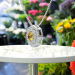 Load image into Gallery viewer, Sunburst Splendor: Unleashing a Round Citrine, Encased in Moissanite Double Halo Pendant Necklace Brilliance
