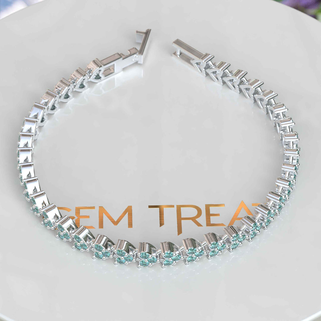 Glistening Sea: Cyan Moissanite Chain Bracelet Splendor