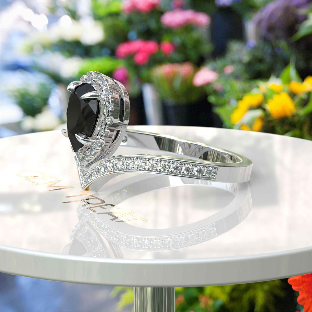 Eclipse of Art & Nature: Pear Cut Black Onyx Halo Ring with Timeless Charm