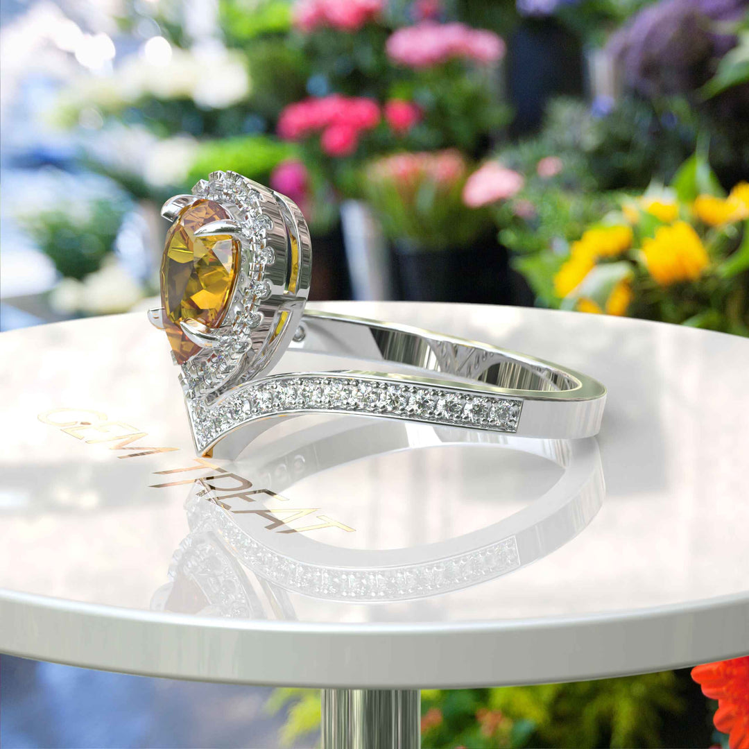 Golden Drop Splendor: Citrine Ring in Pear Cut with Moissanite Halo Highlights