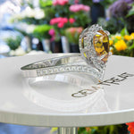 Load image into Gallery viewer, Golden Drop Splendor: Citrine Ring in Pear Cut with Moissanite Halo Highlights
