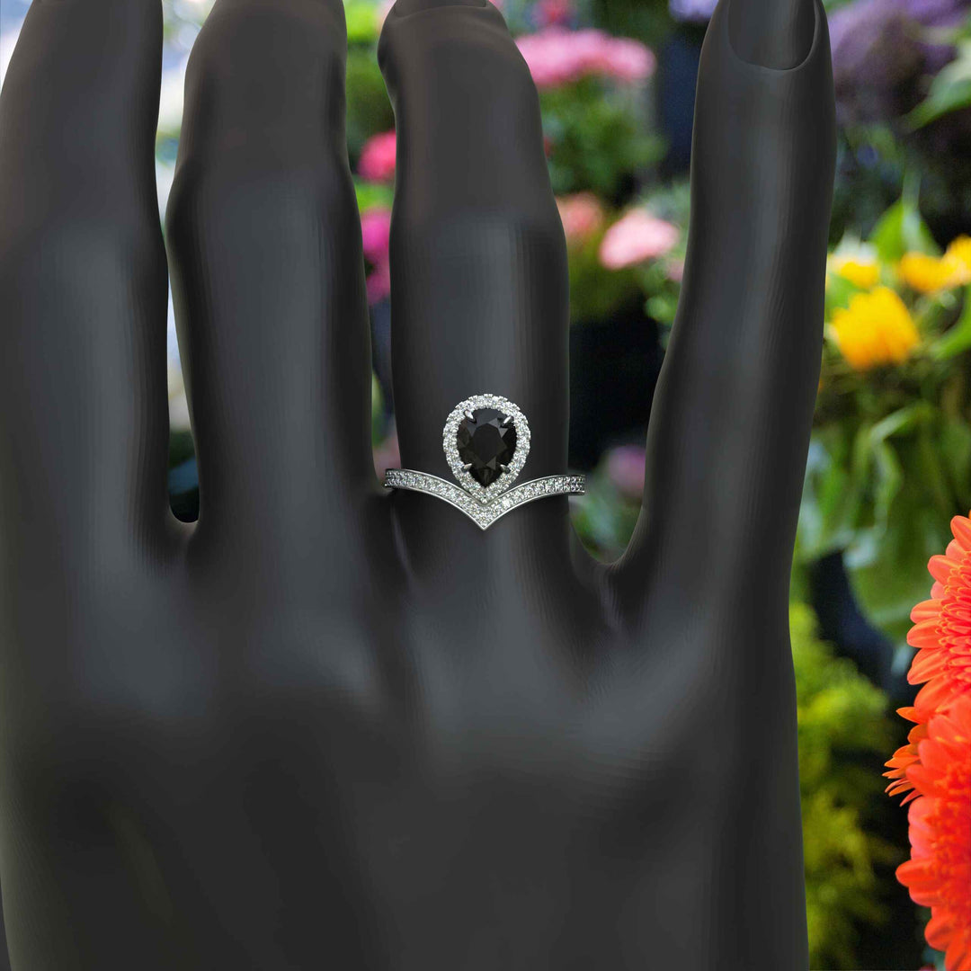 Eclipse of Art & Nature: Pear Cut Black Onyx Halo Ring with Timeless Charm