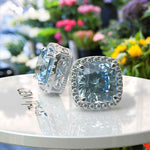 Load image into Gallery viewer, Crystal Marine Majesty: Aquamarine Cushion Stud Earrings with Moissanite Halo Sparkle
