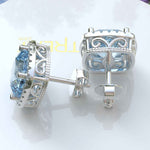 Load image into Gallery viewer, Crystal Marine Majesty: Aquamarine Cushion Stud Earrings with Moissanite Halo Sparkle
