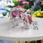 Load image into Gallery viewer, Rosy Radiance: Cushion Pink Sapphire Stud Earrings, Glimmering Moissanite Halo.
