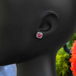 Load image into Gallery viewer, Rosy Radiance: Cushion Pink Sapphire Stud Earrings, Glimmering Moissanite Halo.
