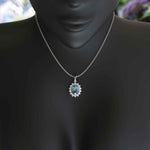 Load image into Gallery viewer, Oval Blue Moissanite Pendant Necklace Adorned with a Dazzling Halo of Moissanites
