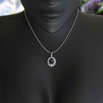 Load image into Gallery viewer, Enchanted Seas: Oval Cut Blue Sapphire Pendant Necklace Adorned with Glistening Moissanite Halo
