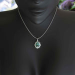 Load image into Gallery viewer, Ethereal Glow: Cyan Moissanite Centerpiece Pendant Necklace, Encircled by a Moissanites Halo
