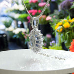 Load image into Gallery viewer, Oval Blue Moissanite Pendant Necklace Adorned with a Dazzling Halo of Moissanites
