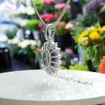 Load image into Gallery viewer, Enchanted Seas: Oval Cut Blue Sapphire Pendant Necklace Adorned with Glistening Moissanite Halo
